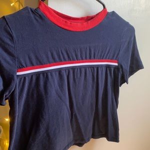 navy blue shirt with red,white, and blue stripes